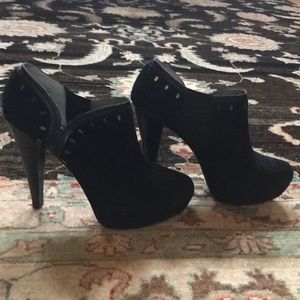 Black booties with metal detail